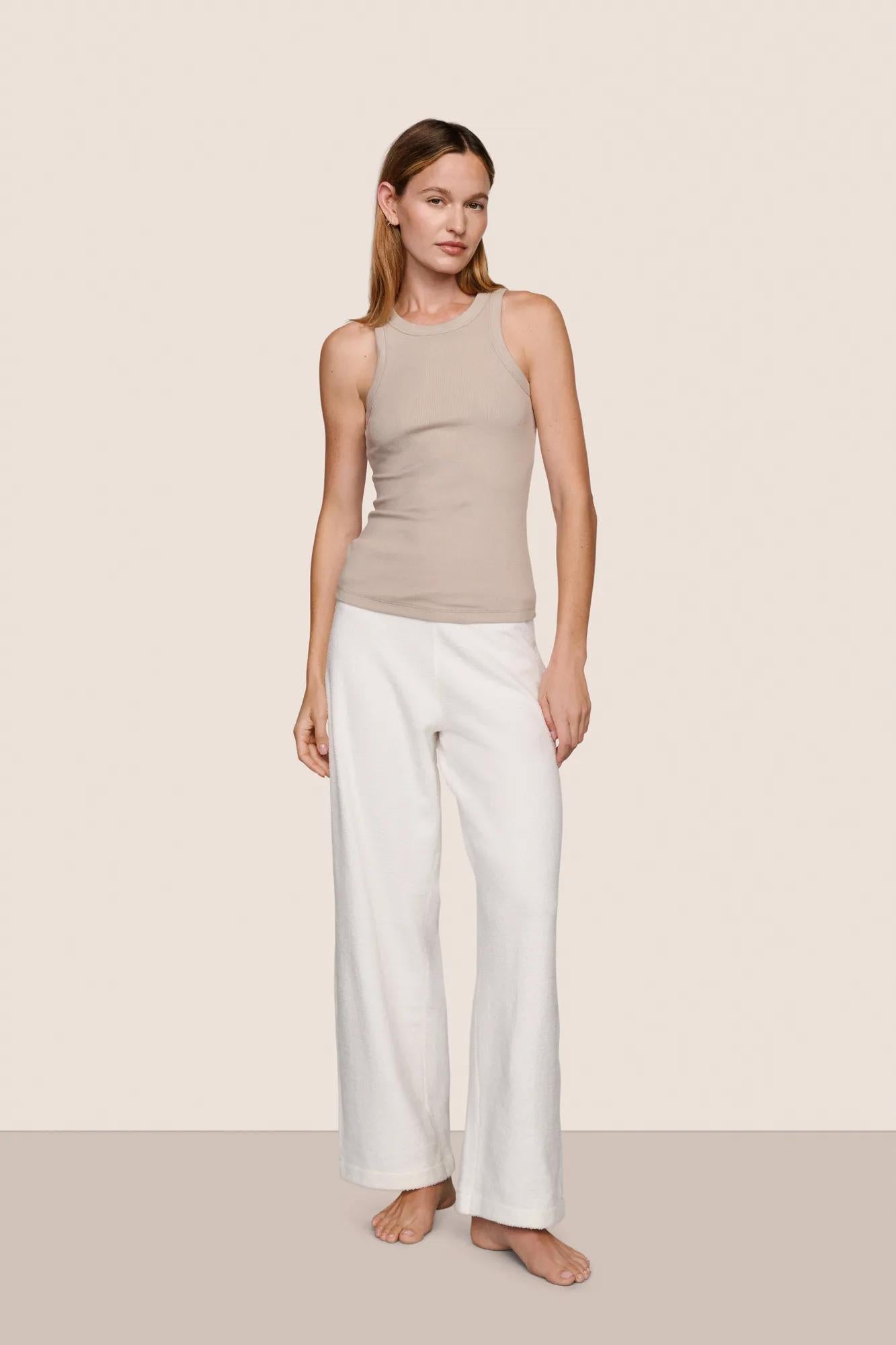 Model is wearing Essential Rib Tank  in Beige