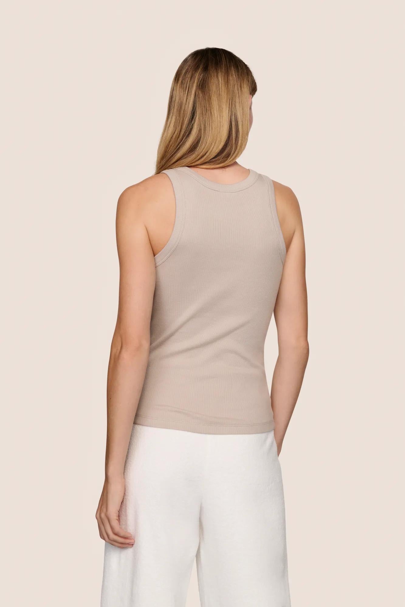 Model is wearing Essential Rib Tank  in Beige