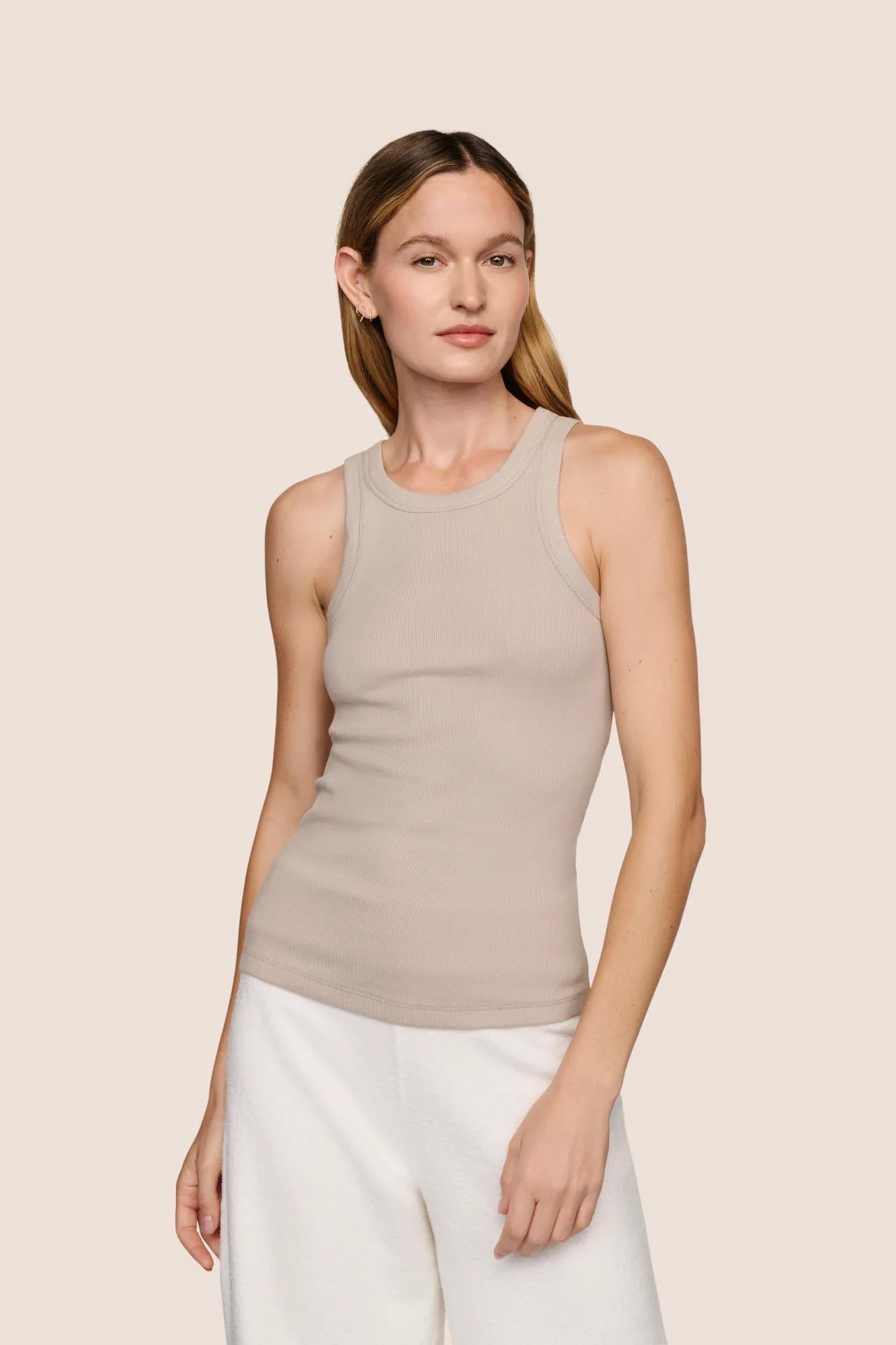 Model is wearing Essential Rib Tank  in Beige