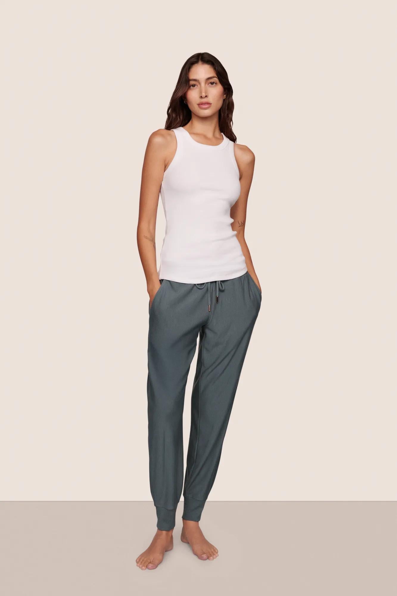 Model is wearing Essential Rib Tank  in White