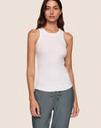 Model is wearing Essential Rib Tank  in White