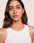 Model is wearing Essential Rib Tank  in White