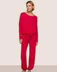 Model is wearing Gisele TENCEL™ Modal Slouchy PJ Set  in Holly Red/Holly Red