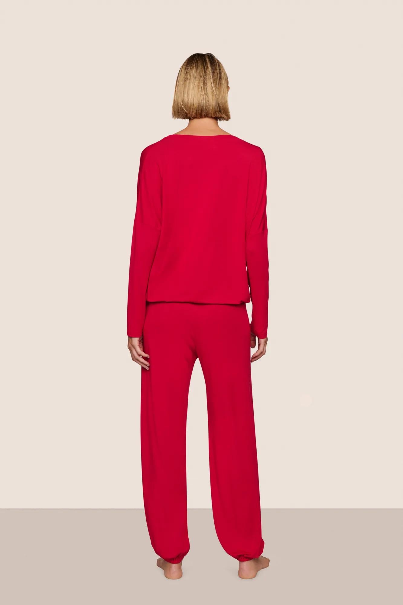 Model is wearing Gisele TENCEL™ Modal Slouchy PJ Set  in Holly Red/Holly Red