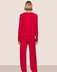 Model is wearing Gisele TENCEL™ Modal Slouchy PJ Set  in Holly Red/Holly Red