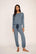 Model is wearing Gisele TENCEL™ Modal Slouchy PJ Set in Moonlight Blue/Navy