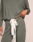 Model is wearing Gisele TENCEL™ Modal Slouchy PJ Set  in Smokey Olive/Ivory