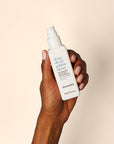 Model holding Deep Sleep Pillow Spray.