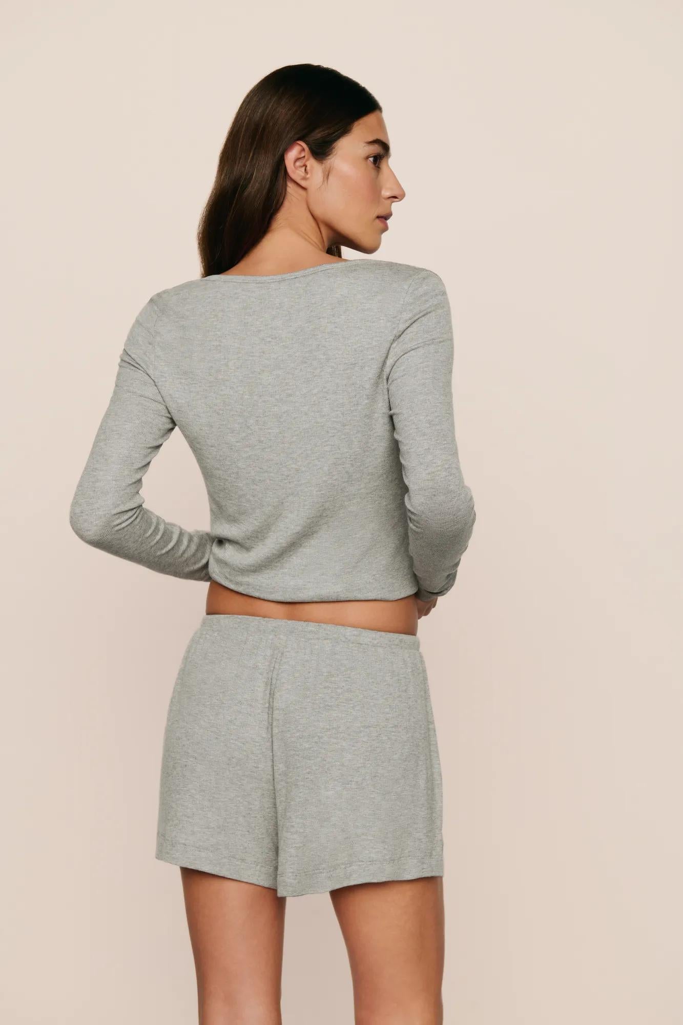 Model is wearing Dream Rib Relaxed Short in Dark Heather Grey