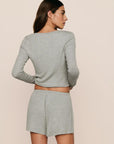 Model is wearing Dream Rib Relaxed Short in Dark Heather Grey