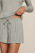 Model is wearing Dream Rib Relaxed Short in Dark Heather Grey