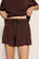 Model is wearing Gisele TENCEL™ Modal Everyday Relaxed Short in Chocolate