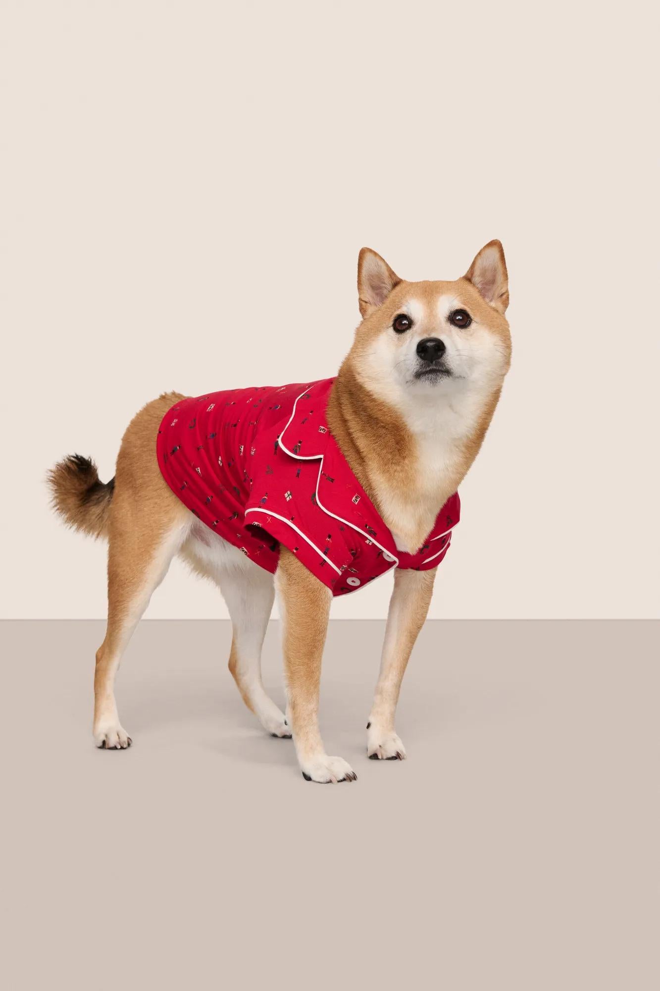 Model is wearing Gisele Printed TENCEL™ Modal Pet PJ  in Nutcracker Holly Red/Ivory