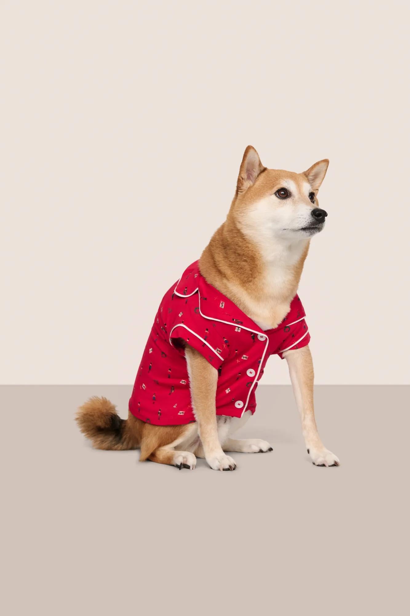 Model is wearing Gisele Printed TENCEL™ Modal Pet PJ  in Nutcracker Holly Red/Ivory