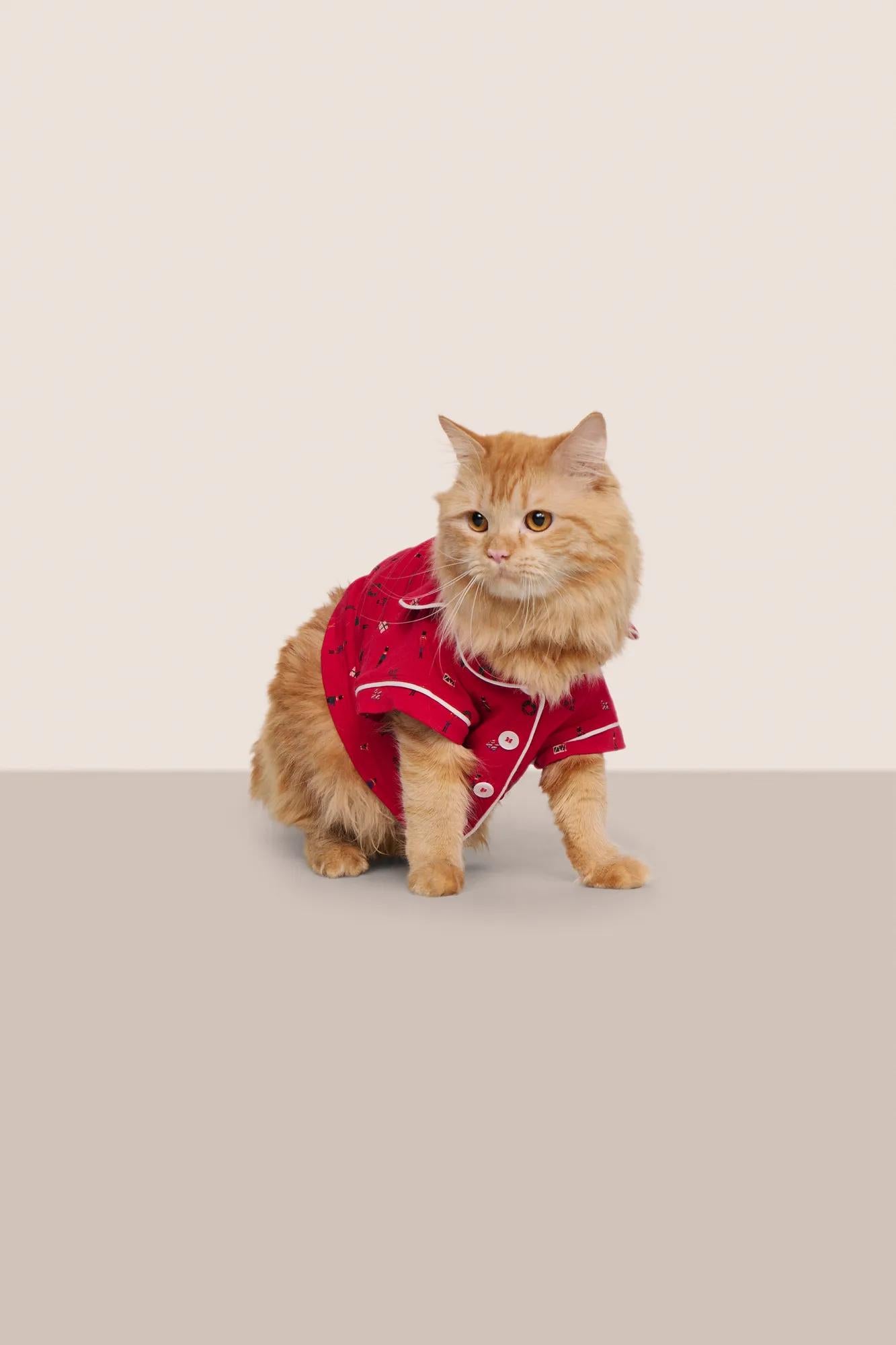 Model is wearing Gisele Printed TENCEL™ Modal Pet PJ  in Nutcracker Holly Red/Ivory