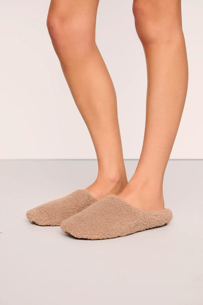 Model is wearing Sherpa Slipper  in  Warm Taupe