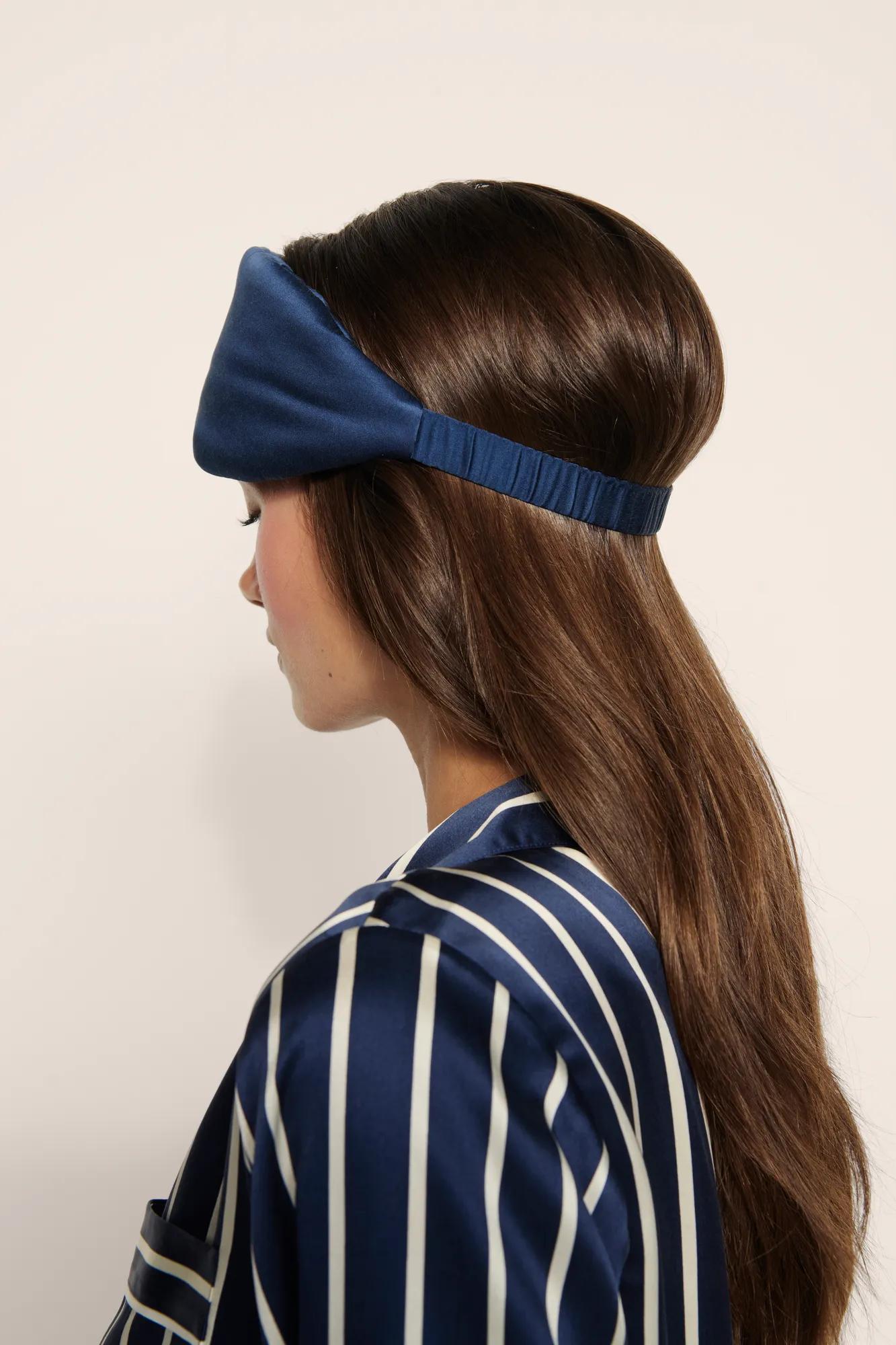 Model is wearing Inez Washable Silk Eye Mask in Navy
