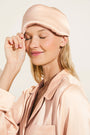 Model wears Inez Washable Silk Eye Mask in Rose Cloud.