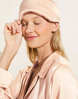 Model wears Inez Washable Silk Eye Mask in Rose Cloud.