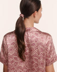 Model is wearing EBJ X ILIA SCRUNCHIE 2PK in Brushstroke Rose/Bloomscape