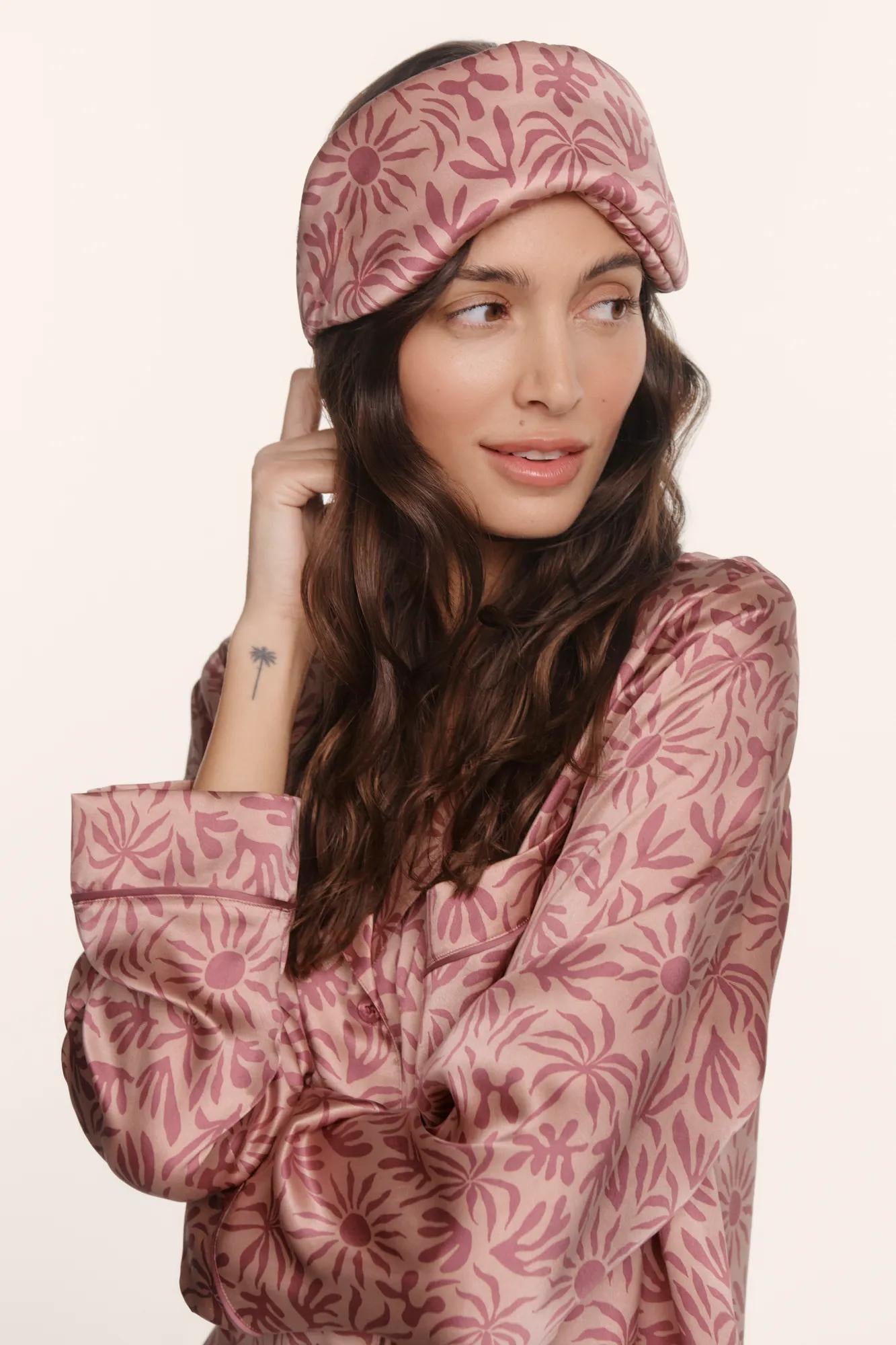 Model is wearing Inez Washable Silk Printed Eye Mask in Bloomscape Misty Rose/Mesa Rose