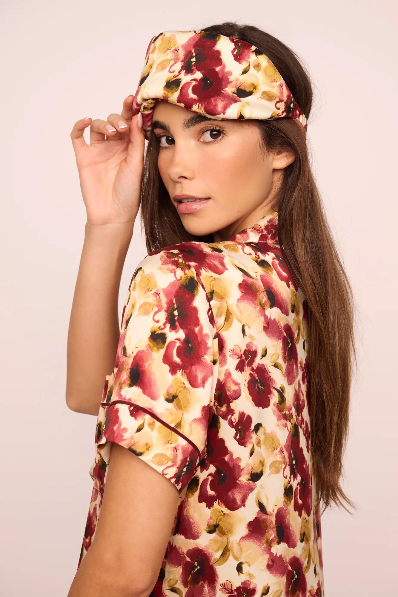 Model is wearing Inez Washable Silk Printed Eye Mask in Botanical Flower Merlot