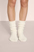 Model is wearing Cozy Socks in Ivory