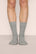 Model is wearing Essential Rib Socks in Dark Heather Grey