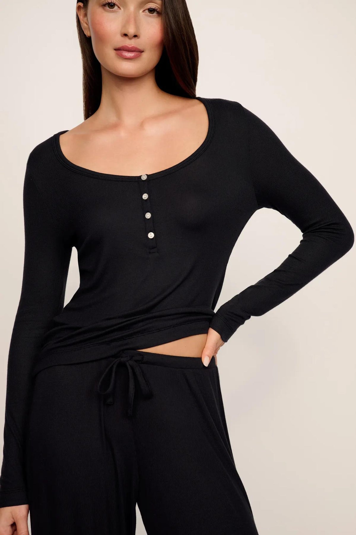Model is wearing Dream Rib V Neck Tank in Black