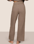 Model is wearing Recycled Boucle Pant  in Deep Taupe