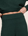 Model is wearing Recycled Boucle Pant  in Pine