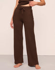 Model is wearing Recycled Sweater Pant  in  Chocolate