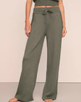 Model is wearing Recycled Sweater Pant  in Smokey Olive
