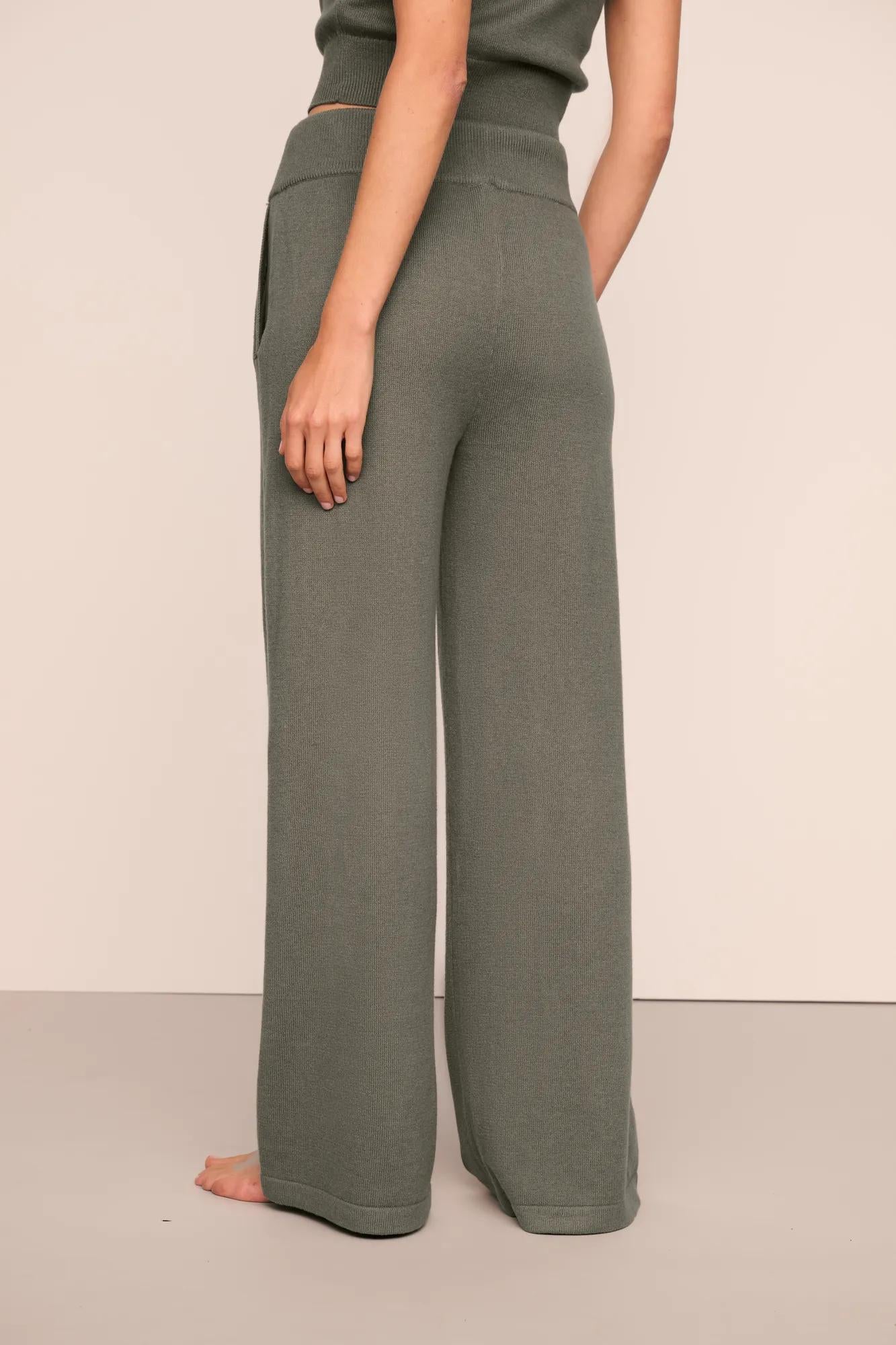 Model is wearing Recycled Sweater Pant  in Smokey Olive