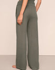 Model is wearing Recycled Sweater Pant  in Smokey Olive