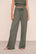 Model is wearing Recycled Sweater Pant  in Smokey Olive