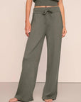 Model is wearing Recycled Sweater Pant  in Smokey Olive