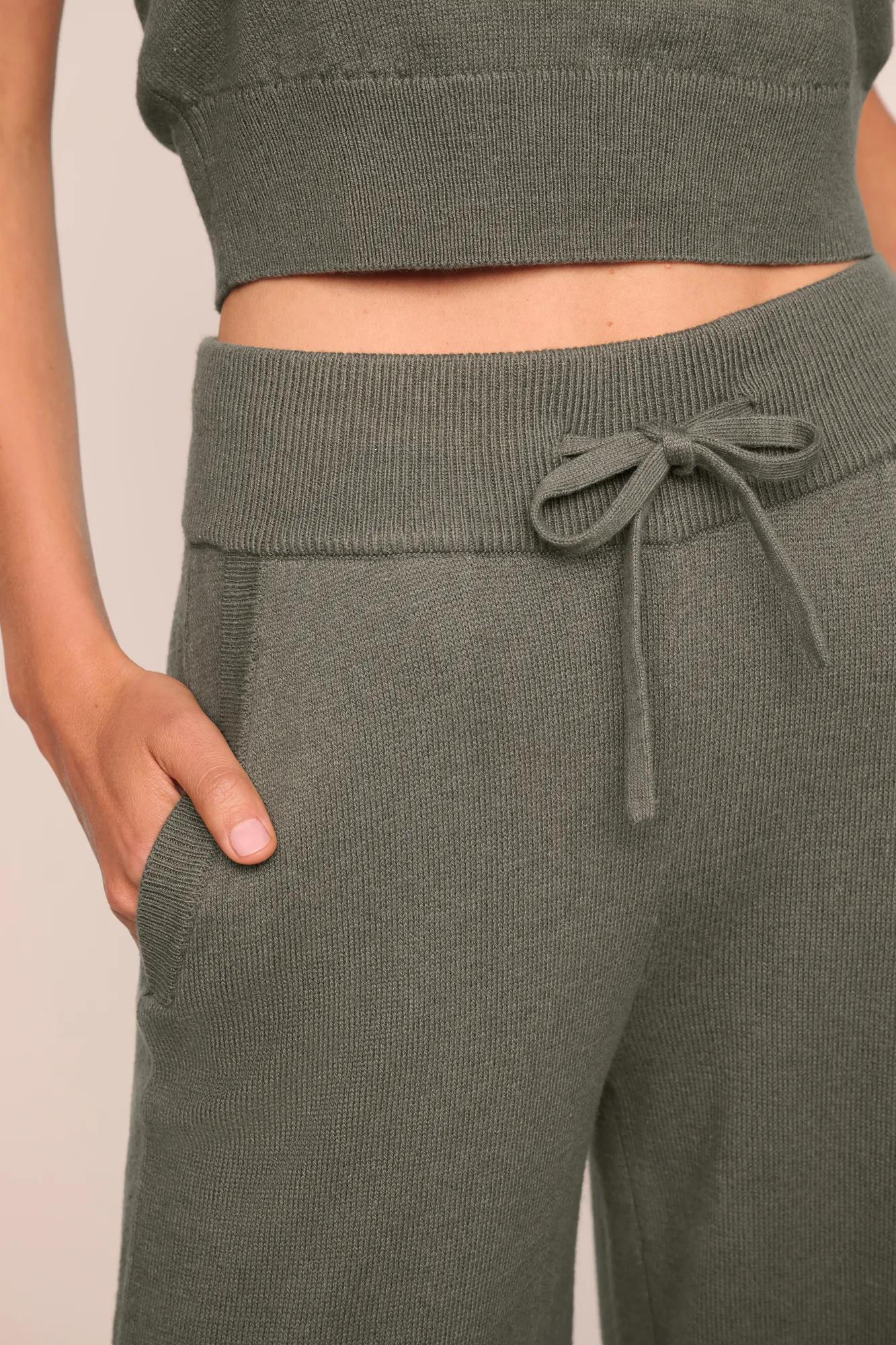 Model is wearing Recycled Sweater Pant  in Smokey Olive