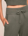 Model is wearing Recycled Sweater Pant  in Smokey Olive