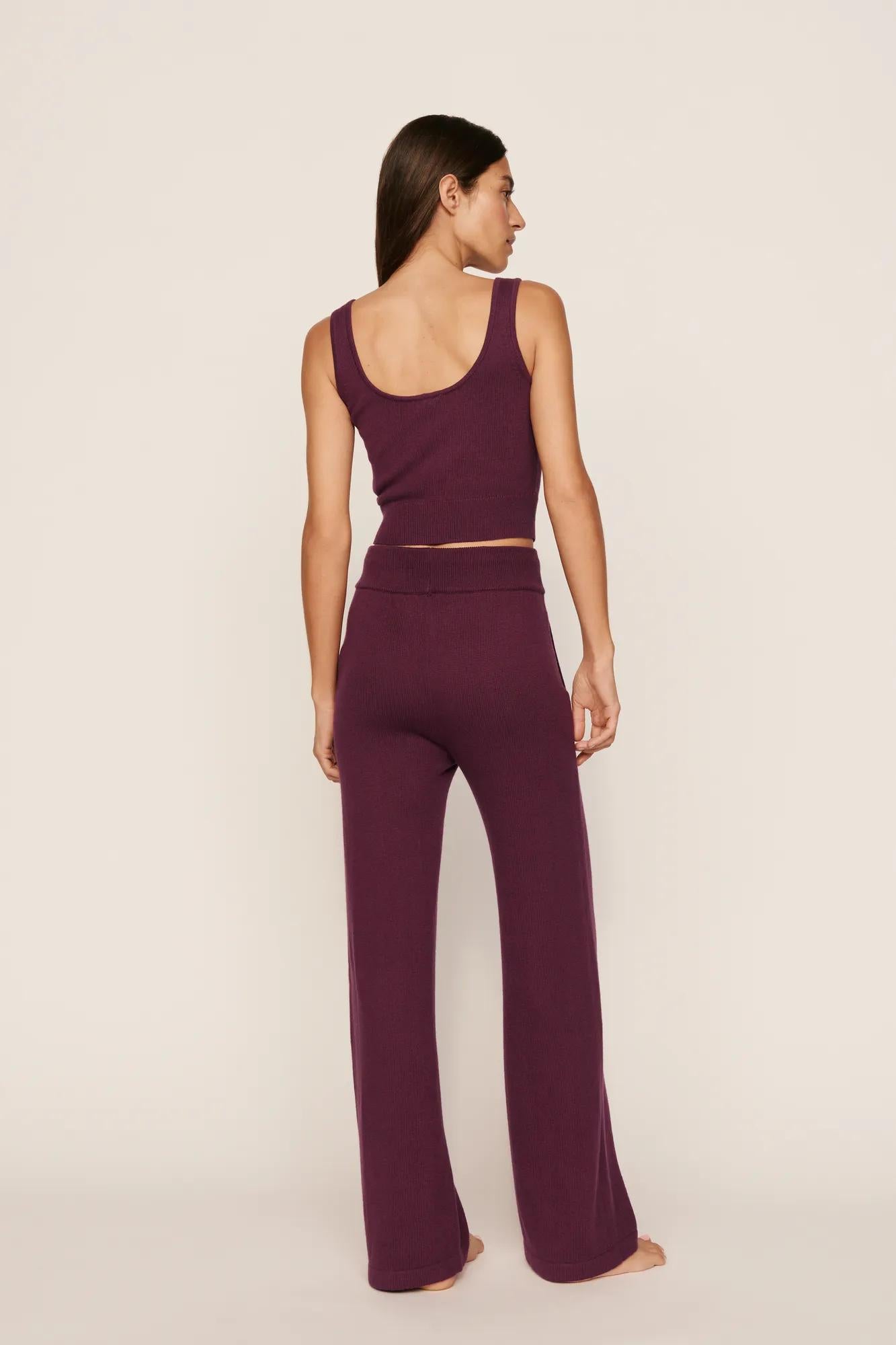 Model is wearing Recycled Sweater Pant in Wildberry