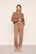 Model is wearing Recycled Sweater Slouchy Pant  in  Hazelnut