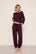 Model is wearing Recycled Sweater Slouchy Pant in Wildberry