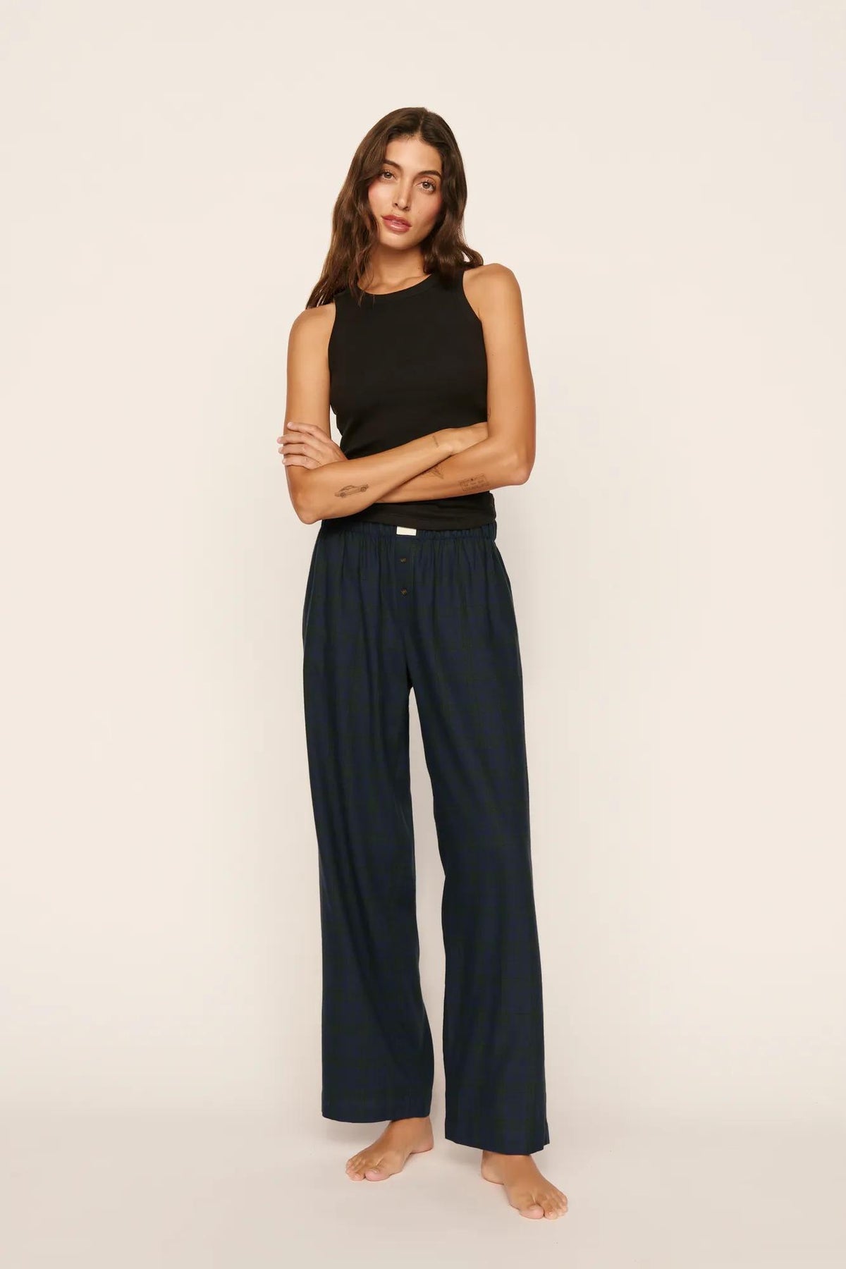 Model is wearing Flannel Boxer Pant in Heritage Check Navy
