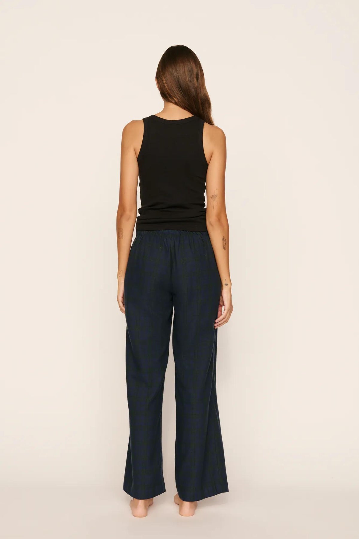 Model is wearing Flannel Boxer Pant in Heritage Check Navy