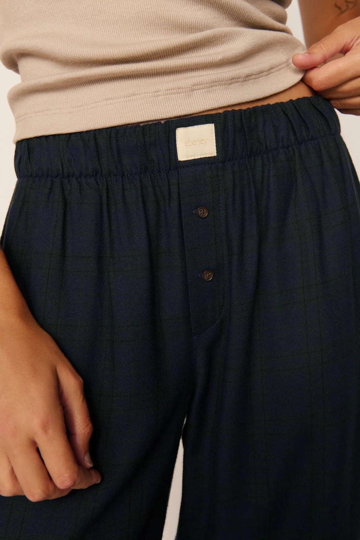 Model is wearing Flannel Boxer Pant in Heritage Check Navy