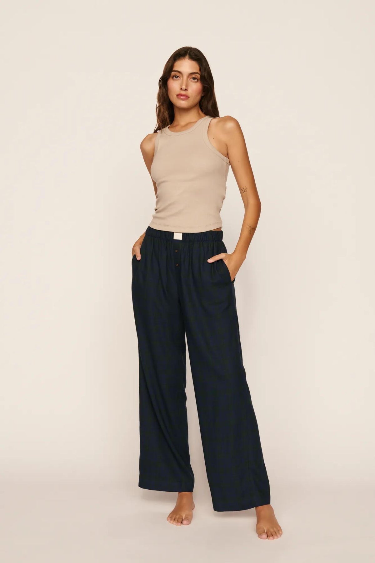 Model is wearing Flannel Boxer Pant in Heritage Check Navy