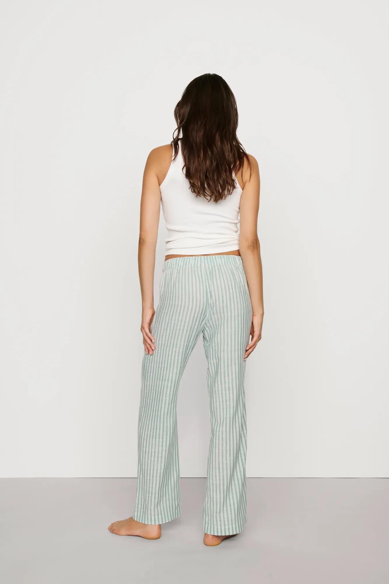 Model is wearing Nautico Boxer Pant in Regatta Stripe Seagrass/White