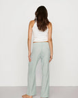 Model is wearing Nautico Boxer Pant in Regatta Stripe Seagrass/White