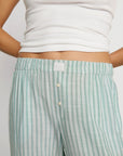 Model is wearing Nautico Boxer Pant in Regatta Stripe Seagrass/White