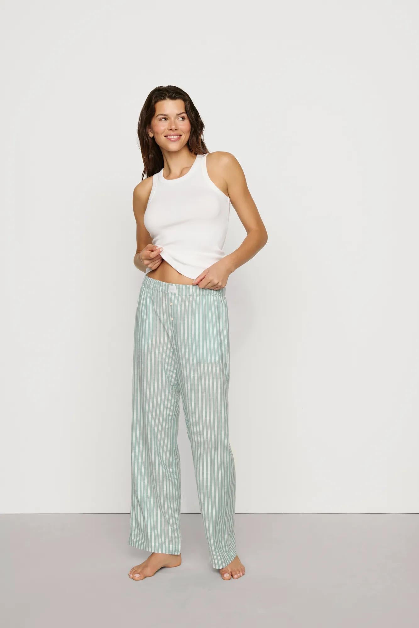 Model is wearing Nautico Boxer Pant in Regatta Stripe Seagrass/White